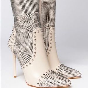 Rhinestones, gems and spikes, a pointed toe shape, skinny stiletto heel.